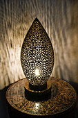 Fes, Morocco. Intricate carved metal lamp.