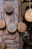 Fes, Morocco. Antique copper pans for sale in the medina