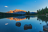 Canada, Alberta, Banff National Park. Mt. Rundle reflected in Two Jack Lake at sunrise.
