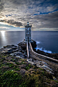 France, Brittany, Le Conquet. Sun setting at the Kermorvan Lighthouse