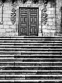 Blue entry door, adorned by branches of grapes, of the Casa Da Parra Santiago De Compostela or Parra House located in the Praza da Quintana de Vivos.