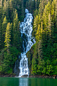 USA, Alaska, Tongass National Forest. Waterfall into Red Bluff Bay.