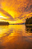 USA, Alaska, Tongass National Forest. Sunset on Admiralty Island and inlet.
