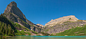USA, Montana, Glacier National Park. Panoramic of mountains and Grinnell Lake in summer.