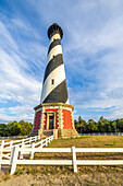 USA, North Carolina, Buxton. Cape Hatteras Lighthouse in late afternoon sun