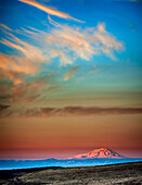 USA, Washington State, Zillah. Dawn light on Mt. Adams seen from Yakima Valley wine country in winter.