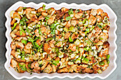 Top view tray of healthy keto stuffing with bread placed on table in kitchen