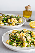 Delicious plate of gnocchi with green asparagus