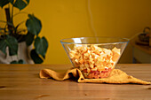 Large glass bowl with chopped assorted healthy vegetables at home