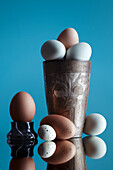 Still life with various eggs in a cup
