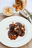 Braised veal cheeks with chanterelles and celeriac puree