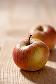 Single apple on wooden table