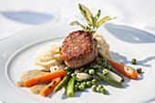 Veal fillet with colourful vegetables and mashed potatoes