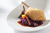 Duck wrapped in pastry on spiced red cabbage