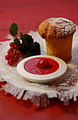 Muffin with cherry sauce