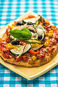 Vegetarian pizza with peppers and courgettes