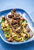 Saddle of veal with pepper sauce, mushrooms and herb ribbon noodles