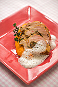 Corn-fed chicken breast stuffed with porcini mushrooms on carrot puree and thyme cream sauce
