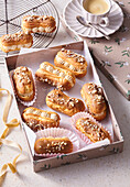 Éclairs with caramel cream and almonds