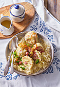 Bread dumplings with bacon, sauerkraut and fried onions