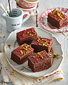 Chocolate spice cake with pistachios and raspberries