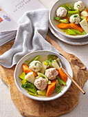Chicken soup with dumplings and vegetables