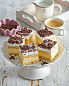 Cake slices with cognac cream and chocolate shavings
