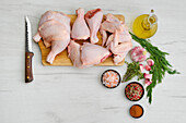 Raw chicken pieces with spices and herbs