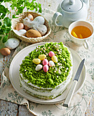 Green Easter cake in egg shape with mascarpone cream