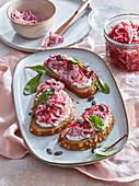 Beetroot spread with pumpkin seeds on rye bread