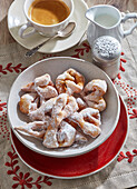 Deep-fried pastries with icing sugar