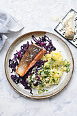 Salmon fillet with red cabbage and potato salad