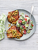 Veal escalope with cucumber and tomato salad