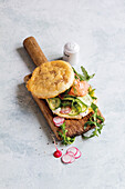 Cloud bread sandwich with smoked salmon and vegetables