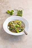 Courgette and emmer spaghetti with basil pesto