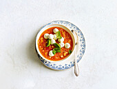 Italian bean soup with mozzarella and basil