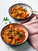 Cauliflower curry with potatoes and herbs