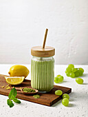Green smoothie with lemon and matcha powder