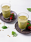 Green smoothie with tomato skewer