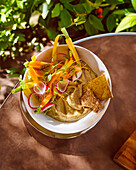 Hummus with vegetable sticks and crackers