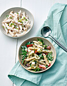 Pasta salad with vegetables and spring onions