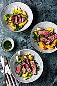 Beef steak with wild garlic oil and spring vegetables