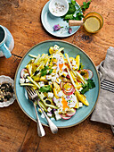 Potato salad with kohlrabi, radish and egg