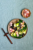 Pak choi salad with pickled radishes and black quinoa
