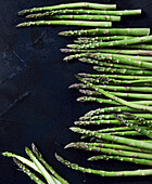 Green asparagus on a black background