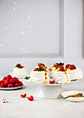 Mini pavlovas with mascarpone, raspberries and passion fruit