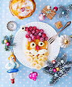 Pancakes decorated for Christmas with fruit