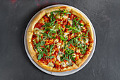 Vegetarian pizza with feta, rocket and mozzarella