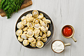 Pelmeni with sour cream and ketchup