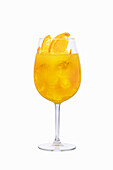 Yellow sangria with orange slices and ice cubes